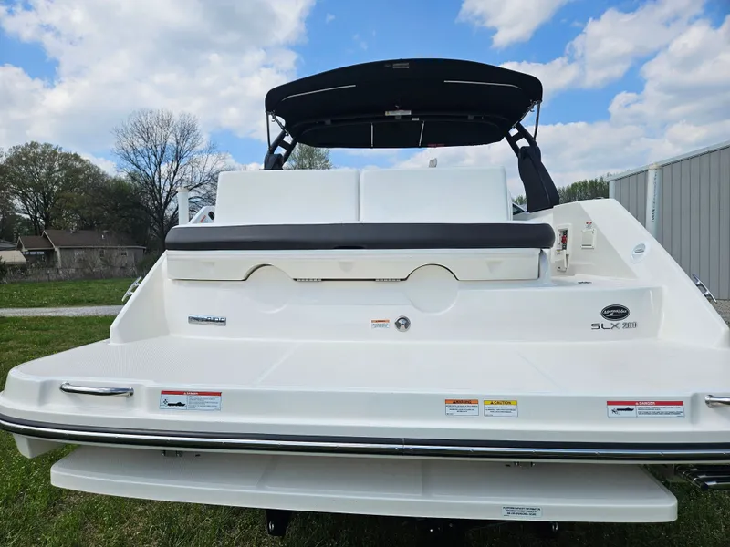 Slide: The Image of Rear view of a 2021 Sea Ray SLX 280 boat under blue sky. - 8