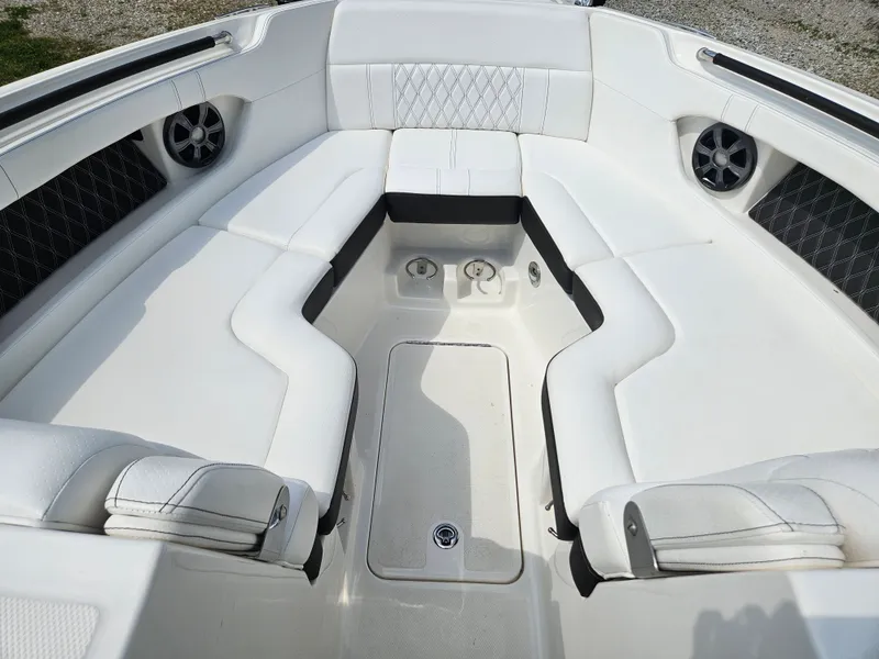 Slide: The Image of Interior of a 2021 Sea Ray SLX 280 with white upholstery. - 9