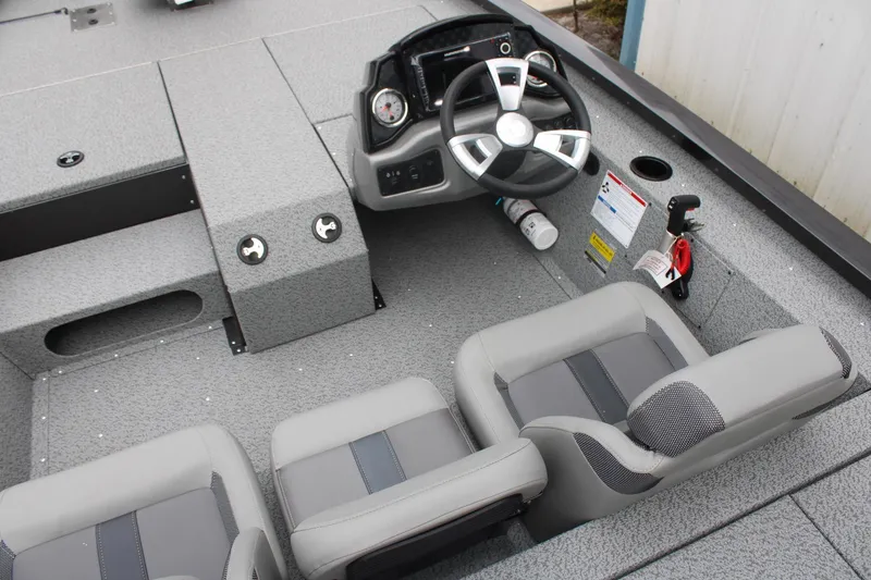 Slide: The Image of 2025 G3 Sportsman 1810 boat interior with steering wheel and seating. - 12