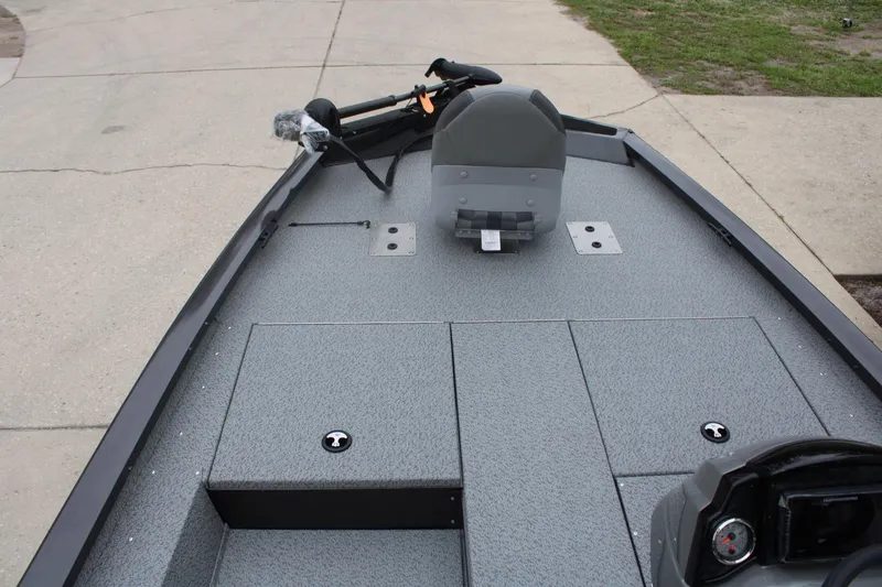 Slide: The Image of 2025 G3 Sportsman 1810 boat deck with seating and storage compartments. - 13