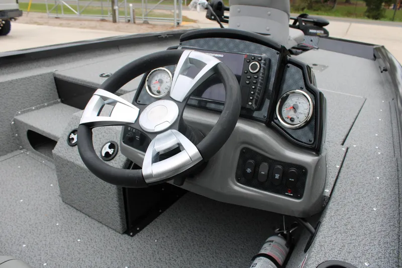 Slide: The Image of 2025 G3 Sportsman 1810 boat dashboard with steering wheel and gauges. - 7