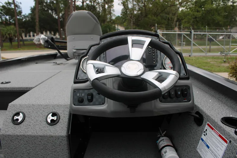Slide: The Image of 2025 G3 Sportsman 1810 boat dashboard with steering wheel and control panel. - 8