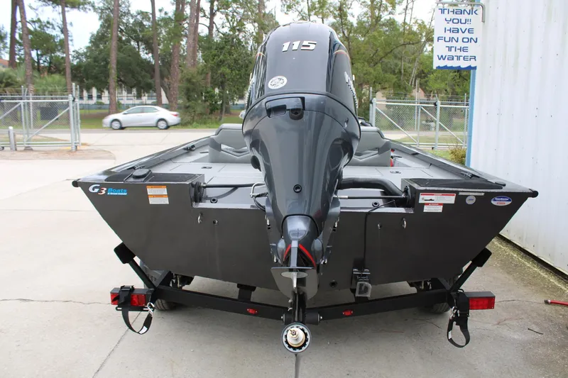 Slide: The Image of 2025 G3 Sportsman 1810 boat with powerful outboard motor, parked outdoors. - 9