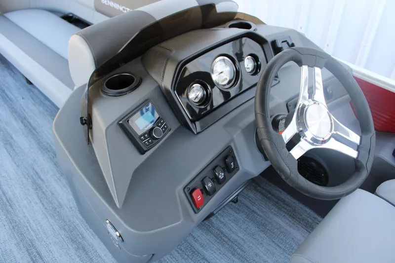 Slide: The Image of 2025 Bennington 20S boat dashboard with steering wheel and control panel. - 10