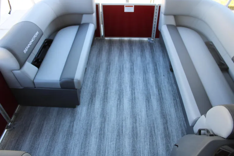 Slide: The Image of Interior of 2025 Bennington 20S pontoon boat with gray seating and flooring. - 12