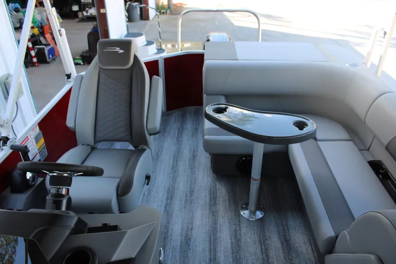 Slide: The Image of 2025 Bennington 20S pontoon boat interior with seating and steering console. - 15