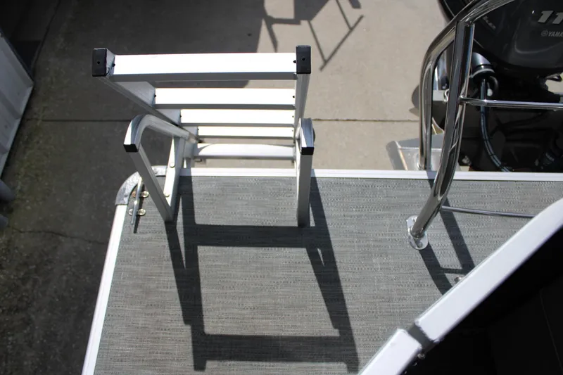 Slide: The Image of 2023 Godfrey Sweetwater 2286 BF boat ladder and deck, featuring sturdy metal construction. - 16
