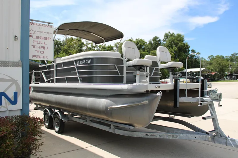 Slide: The Image of 2023 Godfrey Sweetwater 2286 BF pontoon boat on trailer, parked outdoors. - 4