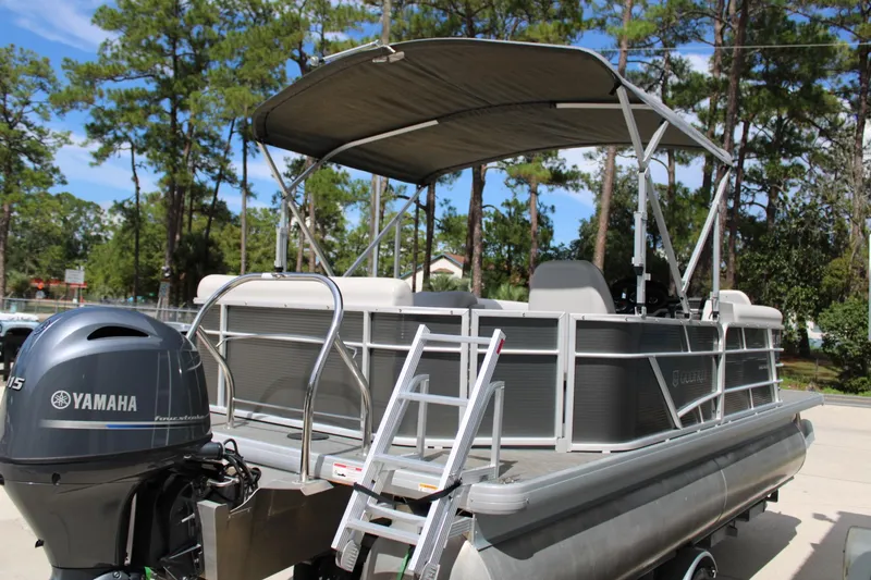 Slide: The Image of 2023 Godfrey Sweetwater 2286 BF pontoon boat with Yamaha motor, parked outdoors. - 8