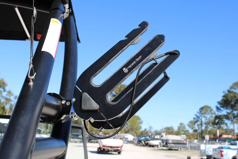 Slide: The Image of Wakeboard rack on 1985 Correct Craft Ski Nautique, clear blue sky background. - 12