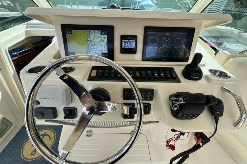 Slide: The Image of Helm of 2016 Grady-White Express 370 with Garmin navigation and control systems. - 12