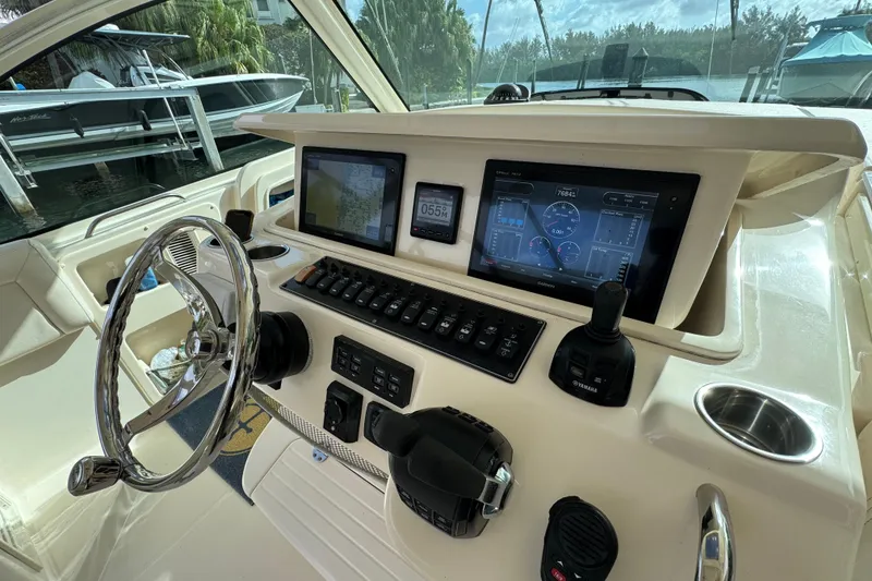 Slide: The Image of Helm of 2016 Grady-White Express 370 with advanced navigation and control systems. - 14