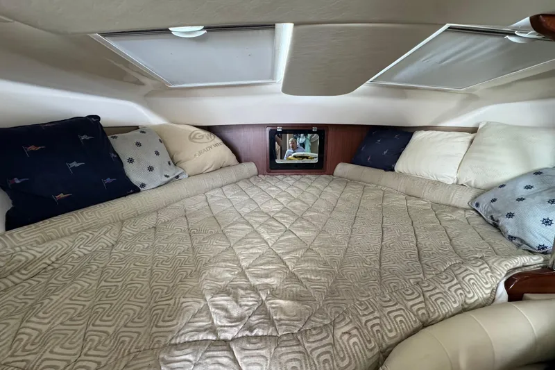 Slide: The Image of Luxurious cabin interior of 2016 Grady-White Express 370 with cozy bedding and pillows. - 16
