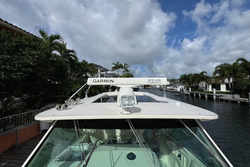 Slide: The Image of 2016 Grady-White Express 370 boat with Garmin xHD2 radar, docked in a scenic canal. - 20