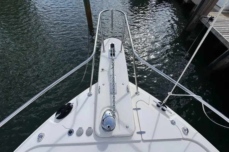 Slide: The Image of Bow view of 2016 Grady-White Express 370 boat with anchor chain and railing. - 21