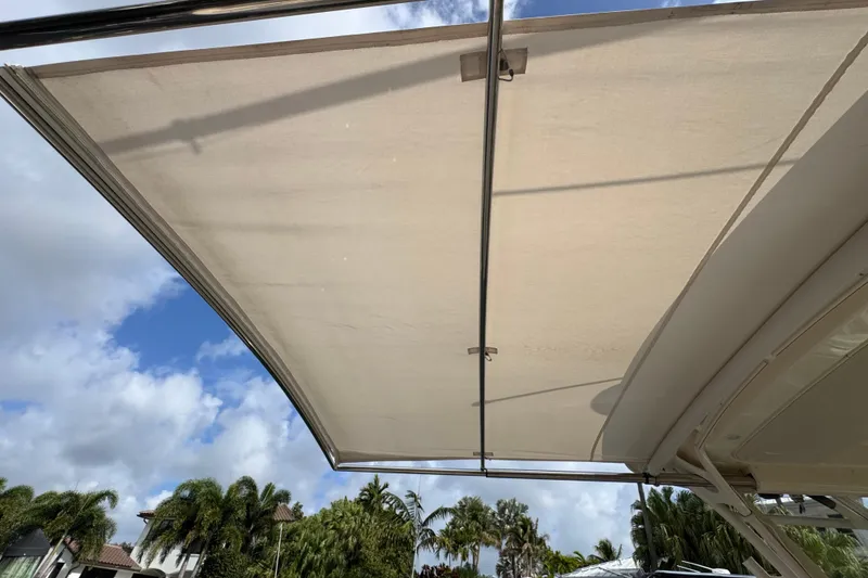 Slide: The Image of 2016 Grady-White Express 370 boat canopy with clear blue sky background. - 24