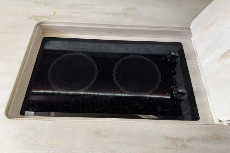 Slide: The Image of Built-in stovetop on 2016 Grady-White Express 370 boat, featuring dual burners and sleek design. - 25