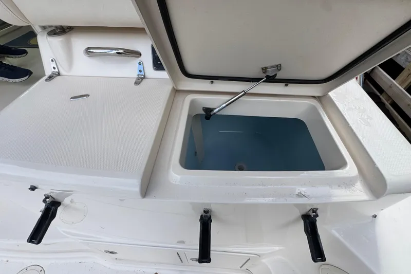 Slide: The Image of Open storage compartment on a 2016 Grady-White Express 370 boat. - 28