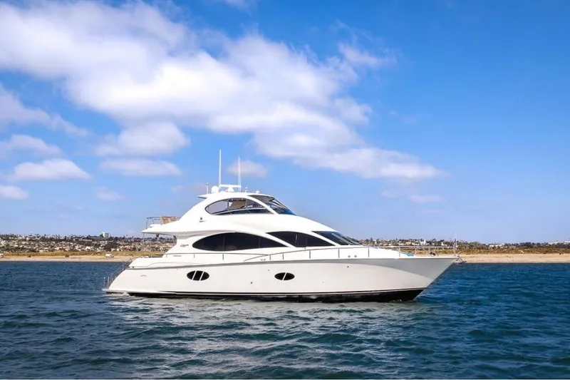 The Image of Luxury 2007 Lazzara 68 yacht cruising on open water under a clear blue sky. - 0