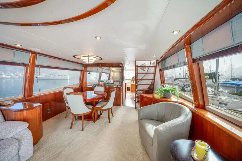 Slide: The Image of Luxurious interior of 2007 Lazzara 68 yacht with elegant wood finishes and panoramic windows. - 11