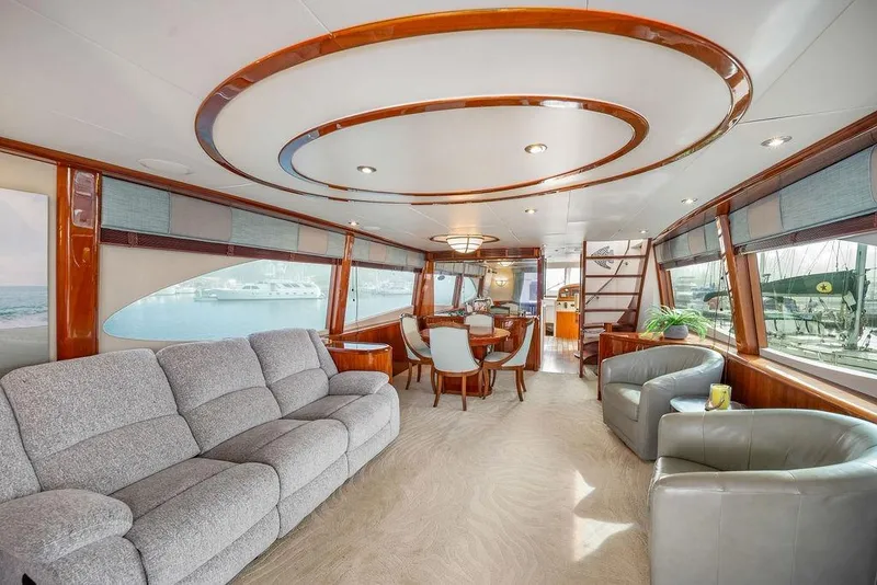 Slide: The Image of Luxurious interior of a 2007 Lazzara 68 yacht with elegant seating and dining area. - 13