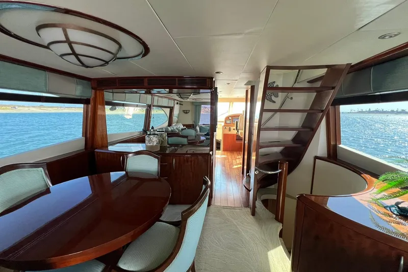 Slide: The Image of Luxurious interior of 2007 Lazzara 68 yacht with elegant dining area and scenic ocean view. - 15