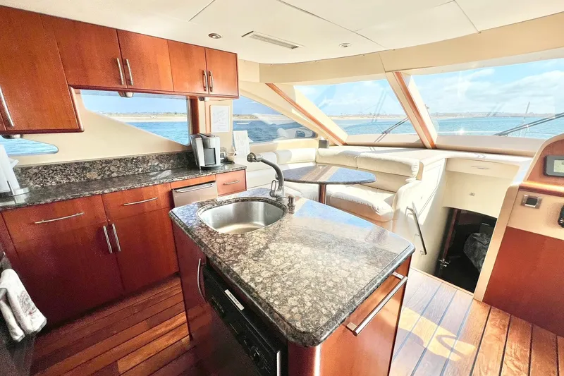 Slide: The Image of Luxurious 2007 Lazzara 68 yacht interior with modern kitchen and ocean view. - 16