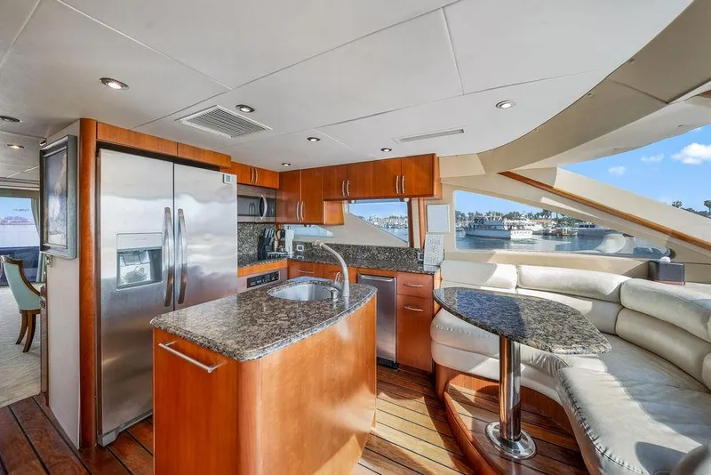 Slide: The Image of Luxurious 2007 Lazzara 68 yacht interior with modern kitchen and scenic window views. - 17