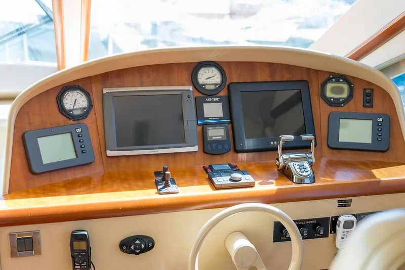 Slide: The Image of Cockpit of 2007 Lazzara 68 yacht featuring navigation and control instruments. - 24