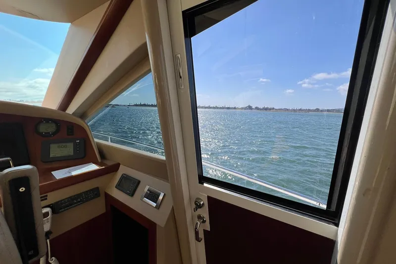 Slide: The Image of Pilothouse view from 2007 Lazzara 68 yacht, overlooking serene ocean waters. - 25