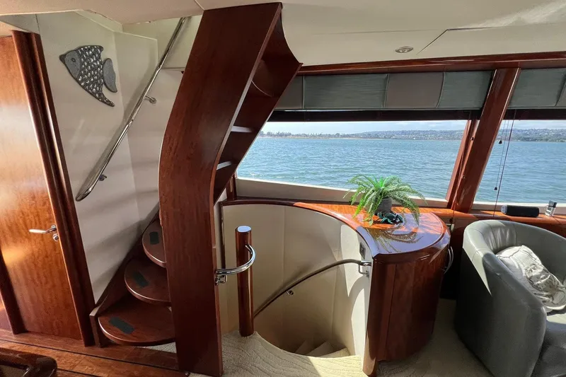 Slide: The Image of Luxurious interior of 2007 Lazzara 68 yacht with elegant wood staircase and scenic water view. - 27