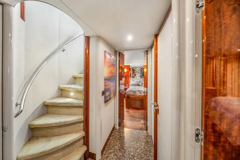 Slide: The Image of Luxurious interior of 2007 Lazzara 68 yacht featuring elegant staircase and cozy bedroom. - 29