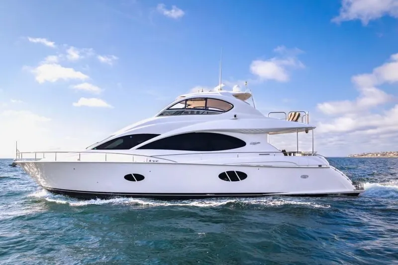 The Image of Luxury 2007 Lazzara 68 yacht cruising on open water under a clear blue sky. - 3