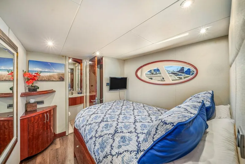 Slide: The Image of Luxurious 2007 Lazzara 68 yacht bedroom with elegant decor and modern amenities. - 32