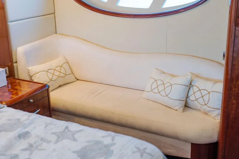 Slide: The Image of Luxurious interior of 2007 Lazzara 68 yacht with elegant cream sofa and decorative pillows. - 36