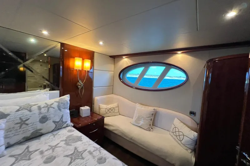 Slide: The Image of Luxurious 2007 Lazzara 68 yacht bedroom with ocean view and elegant decor. - 39