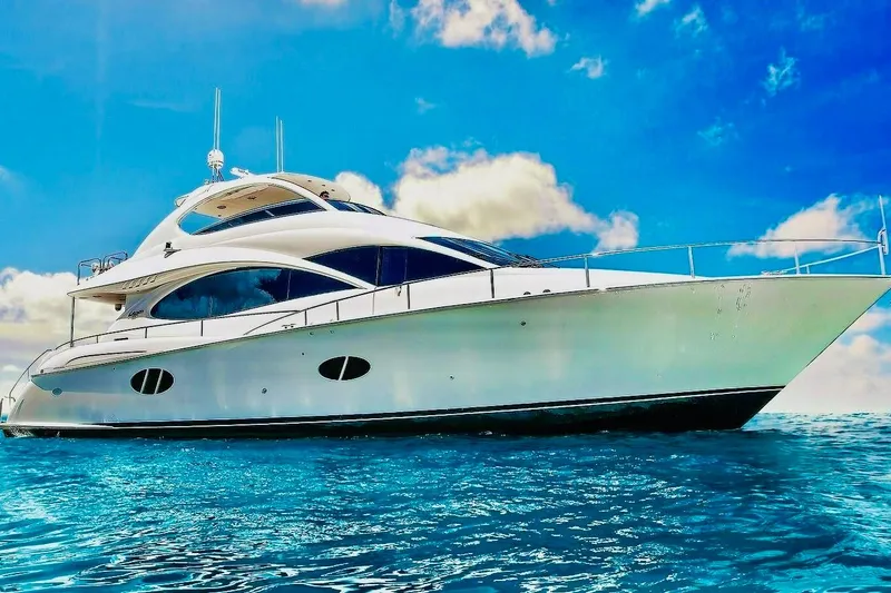 Slide: The Image of Luxurious 2007 Lazzara 68 yacht cruising on clear blue waters under a bright sky. - 4