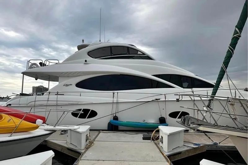 Slide: The Image of Luxury 2007 Lazzara 68 yacht docked at marina under cloudy sky. - 6