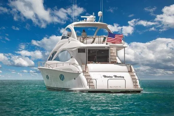 Slide: The Image of Luxury 2007 Lazzara 68 yacht cruising on open sea under clear blue skies. - 7