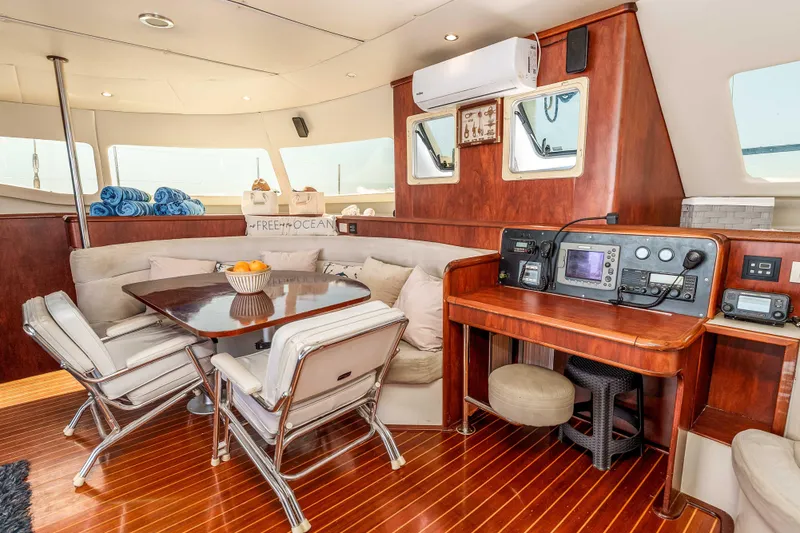 Slide: The Image of Luxurious interior of 2009 Kelsall KSS 58 yacht with dining area and navigation station. - 17