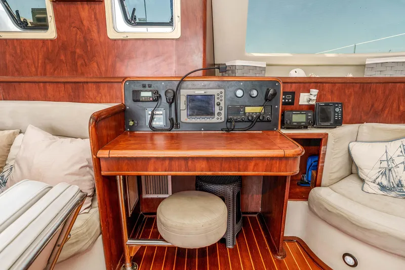 Slide: The Image of Navigation station of 2009 Kelsall KSS 58 yacht with wooden finish and marine electronics. - 18