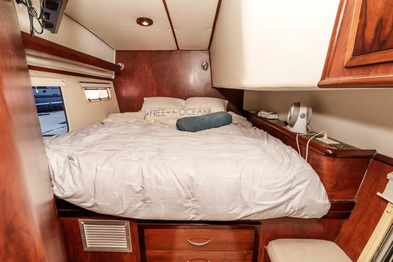 Slide: The Image of Cozy cabin interior of 2009 Kelsall KSS 58 yacht with wooden furnishings and comfortable bedding. - 27