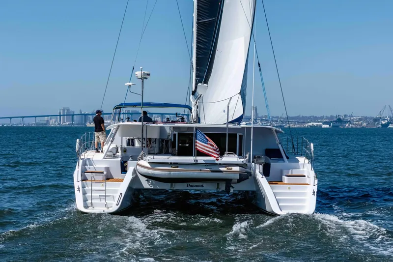 Slide: The Image of Sailing catamaran Kelsall KSS 58 (2009) on open water with city skyline backdrop. - 3