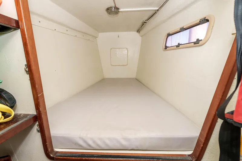 Slide: The Image of Compact cabin interior of 2009 Kelsall KSS 58 yacht with a single bed. - 33