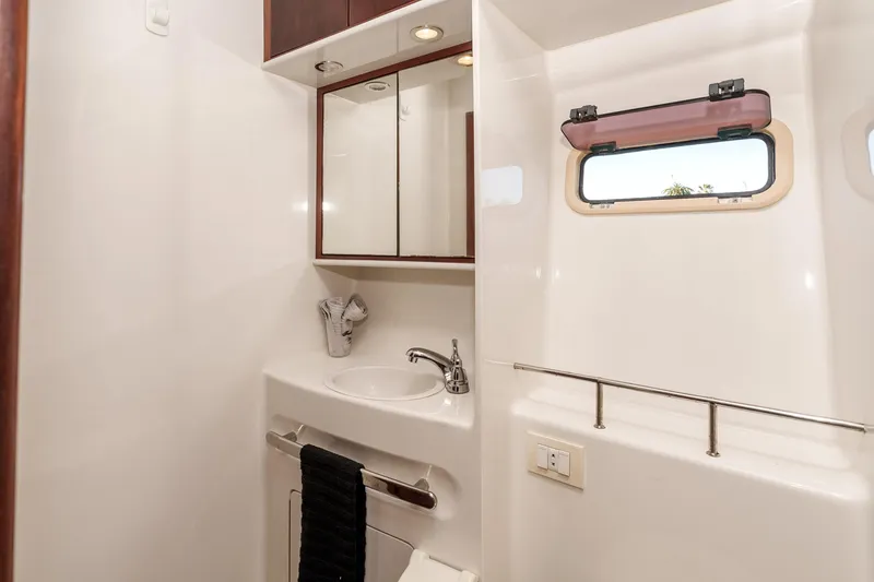 Slide: The Image of Luxurious bathroom in 2009 Kelsall KSS 58 yacht with sink, mirror, and window. - 36