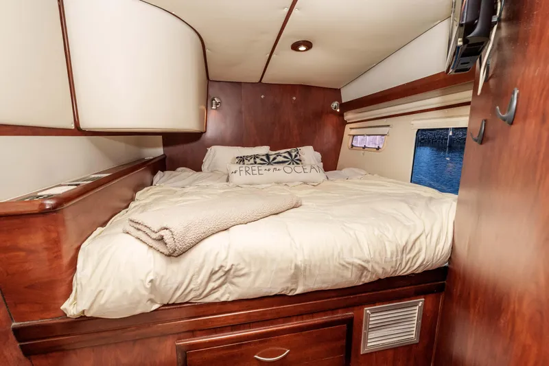 Slide: The Image of Cozy cabin bedroom in 2009 Kelsall KSS 58 yacht with wooden interior and ocean view. - 39