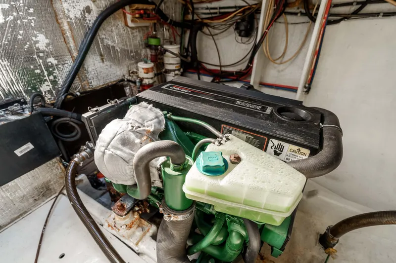 Slide: The Image of Engine compartment of a 2009 Kelsall KSS 58, featuring a detailed view of the machinery. - 44