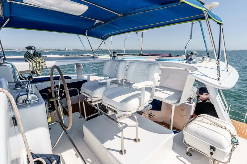 Slide: The Image of Cockpit of 2009 Kelsall KSS 58 yacht with blue canopy and white seating. - 6