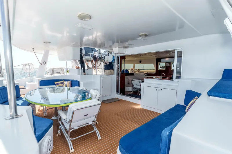Slide: The Image of Spacious deck of 2009 Kelsall KSS 58 yacht with seating and dining area. - 9
