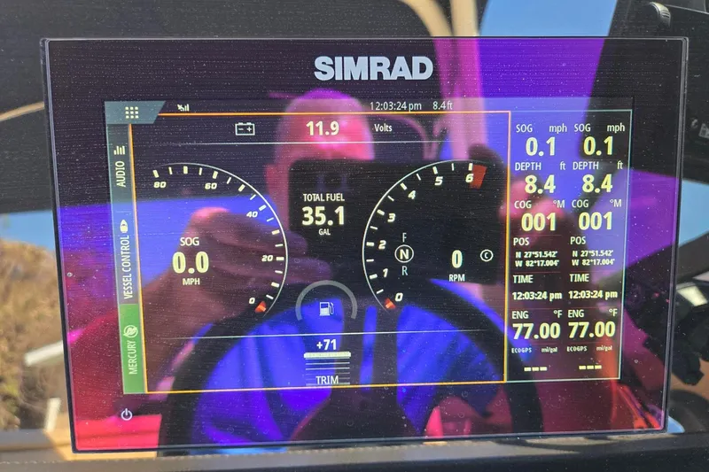 Slide: The Image of Simrad display on 2019 Sea Ray SDX 270 Outboard showing navigation and engine data. - 10